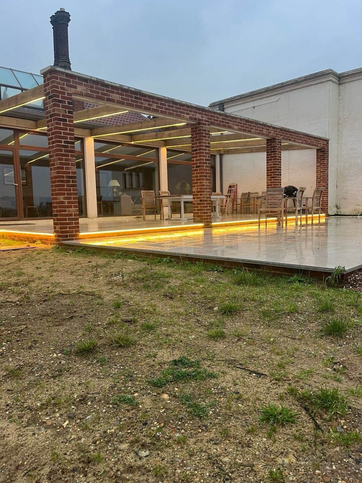 LED strip lighting under a garden pergola, fitted by Snelling Electrical